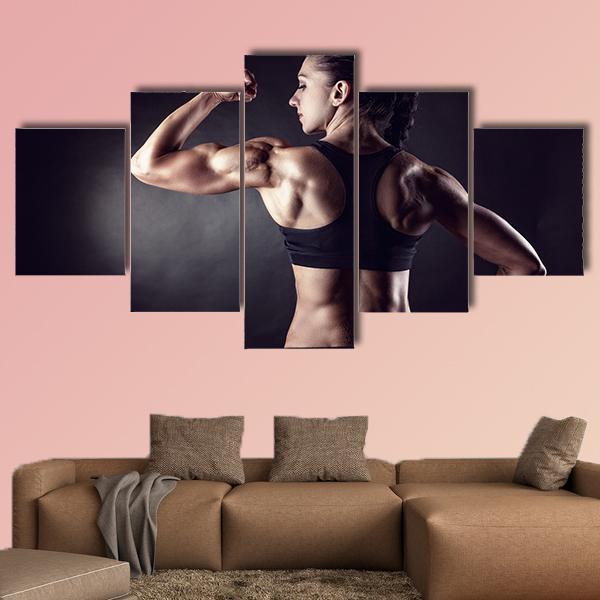 Athletic Young Woman Showing Muscles – Sport Canvas Wall Art