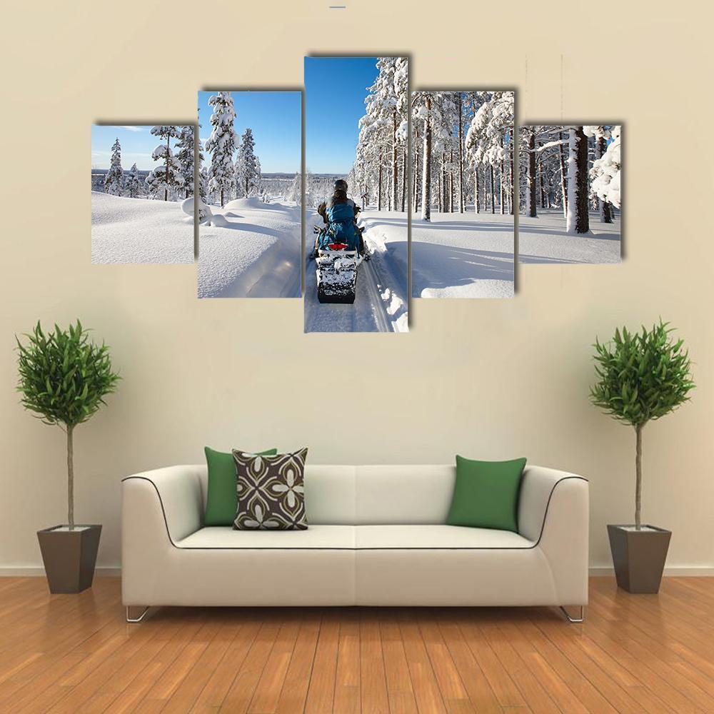 Man Traveling Finnish Lapland With Snowmobile – Nature Canvas Wall Art