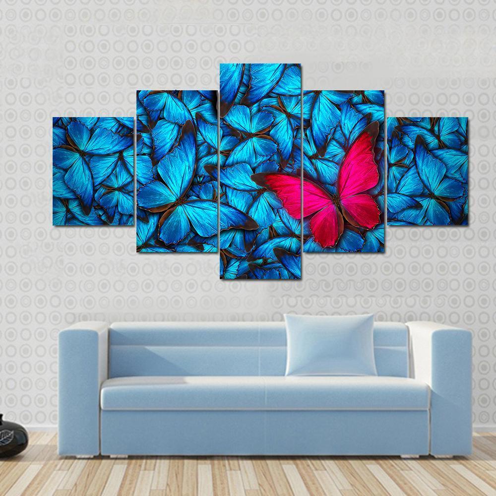 Pink Butterfly On Group Of Blue Butterfly – Animal Canvas Wall Art