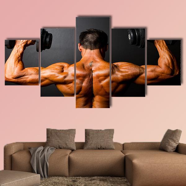 Rear View Of Body Builder With Dumbbells – Sport Canvas Wall Art