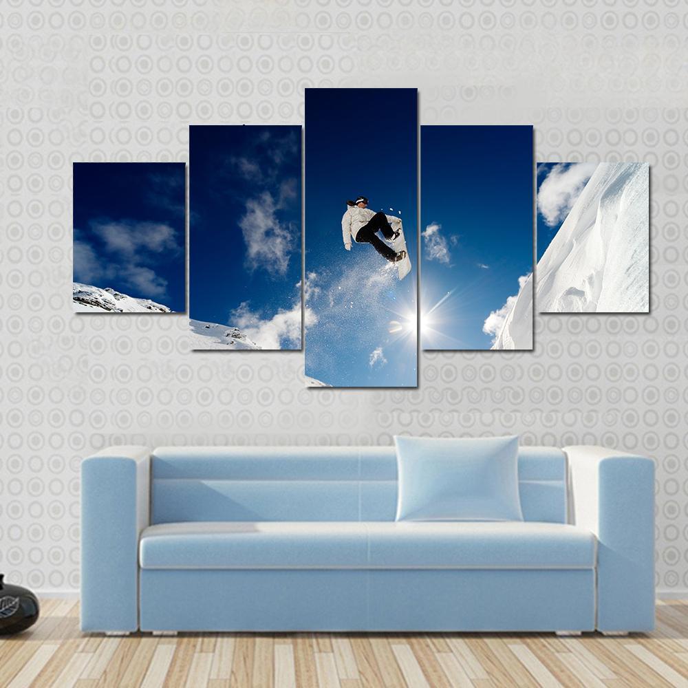 Snowboarder Jumping Through The Air With Blue Sky – Sport Canvas Wall Art